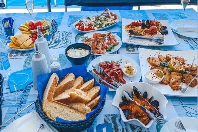 Half-Day Exclusive Catamaran Cruise in Santorini with Meal and Open Bar - Thirassia Island and lunch on the catamaran