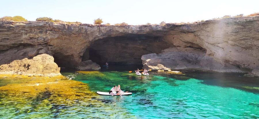 Ibiza: Snorkeling, Sunset Beach and Cave Boat Trip - Cala Comte: clear water and paddleboard time