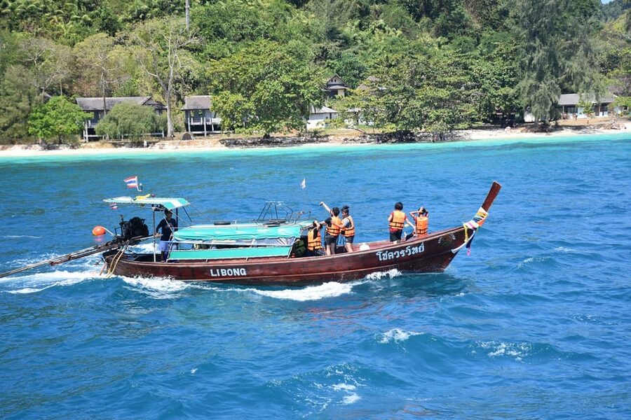 Koh Lanta: 4 Islands and Emerald Cave Tour by Longtail Boat - Swimming through Emerald Cave on Koh Mook