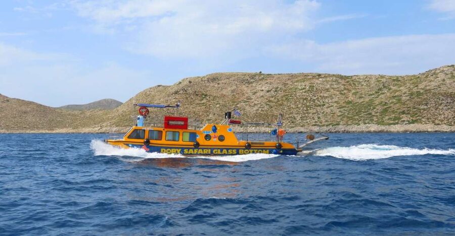 Kos Town: Glass-Bottom Boat Cruise with Swimming Stops - Boarding the yellow Dorry in Kos Town