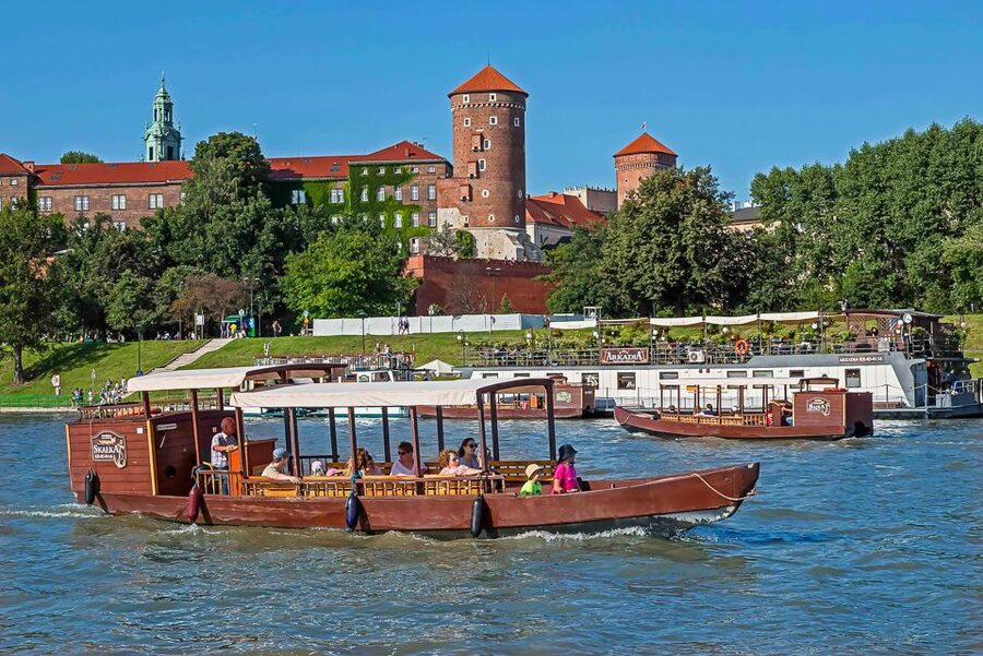 Krakow: Sightseeing Cruise by Vistula River - The open deck, seating, and audio