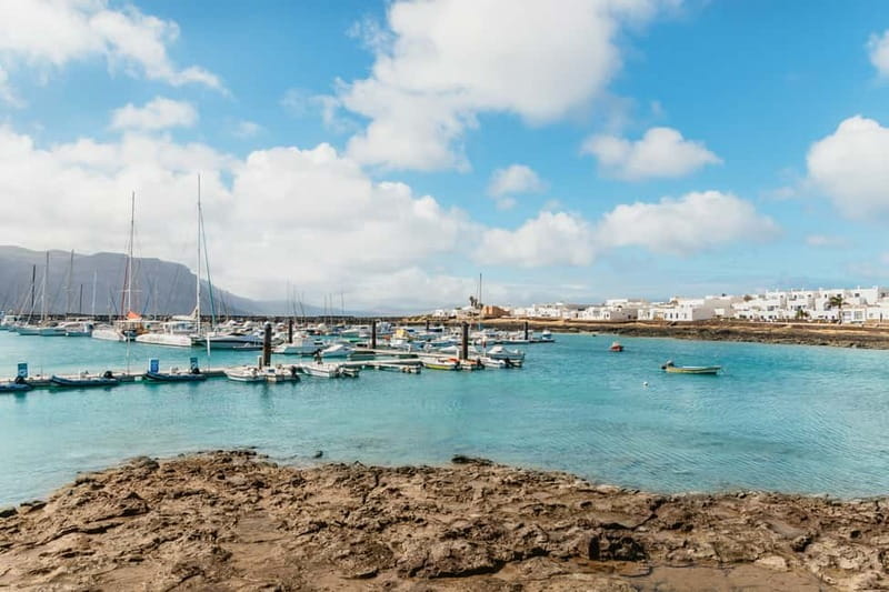 La Graciosa: Island Cruise with Lunch and Water Activities - Sailing toward French Beach