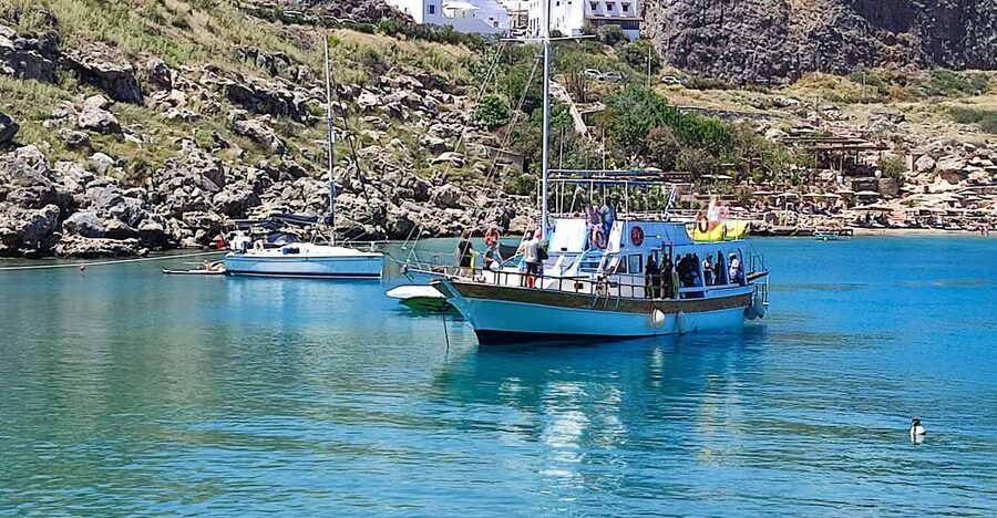 Lindos: Rhodes South-East Coast Cruise with Swim Stops - Calypso’s Shade, Sun, and Social Atmosphere