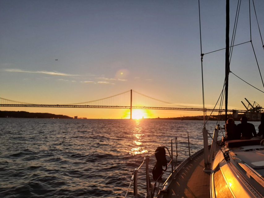 Lisbon: City Skyline Sailboat Cruise with Drink and Snacks - Praça do Comércio and old Lisbon from the water