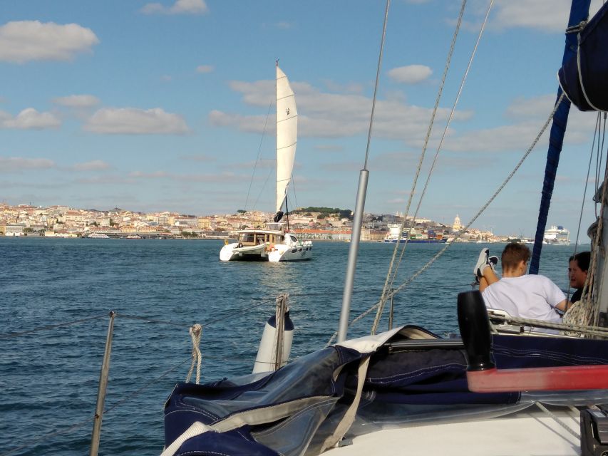 Lisbon: Sailing Tour with Wine and Snacks - Passing beneath the 25 de Abril Bridge