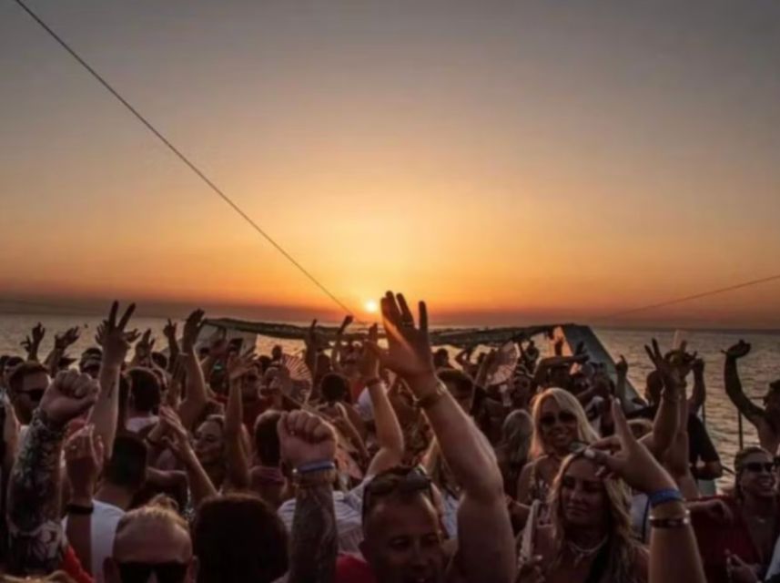 Lisbon: Sunset Boat Party Cruise with DJ and Open Bar - Leaving Commerce Square behind