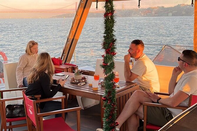Lisbon: Sunset Catamaran Boat Tour with Music and Drinks - Cristo Rei and the opening river views