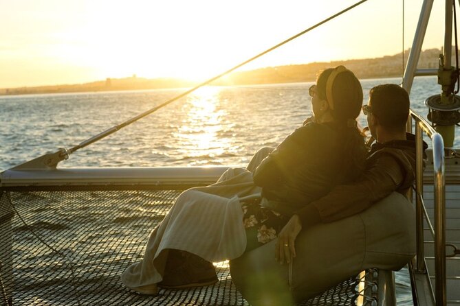 Lisbon: Sunset Catamaran Boat Tour with Music and Drinks - Passing beneath the 25th of April Bridge
