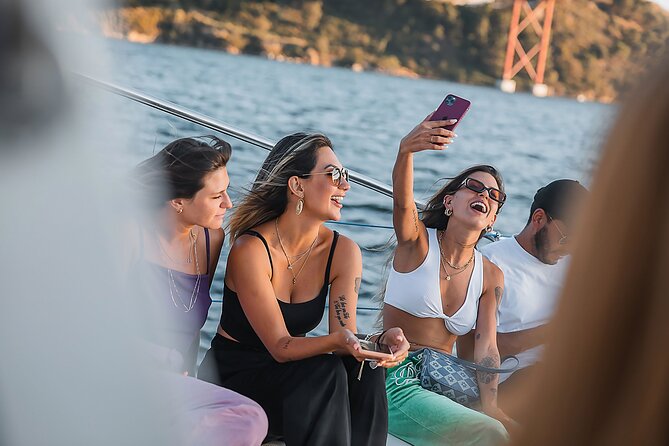 Lisbon: Sunset Catamaran Boat Tour with Music and Drinks - The Monument to the Discoveries and Jerónimos Monastery