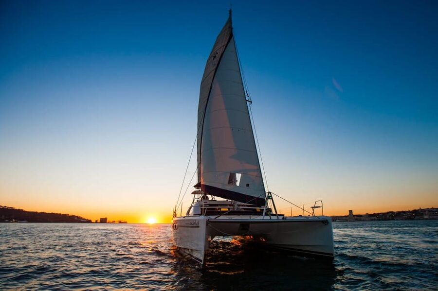 Lisbon: Sunset Cruise With Drinks on Spacious Yacht - The yacht, seating, and open-air comfort
