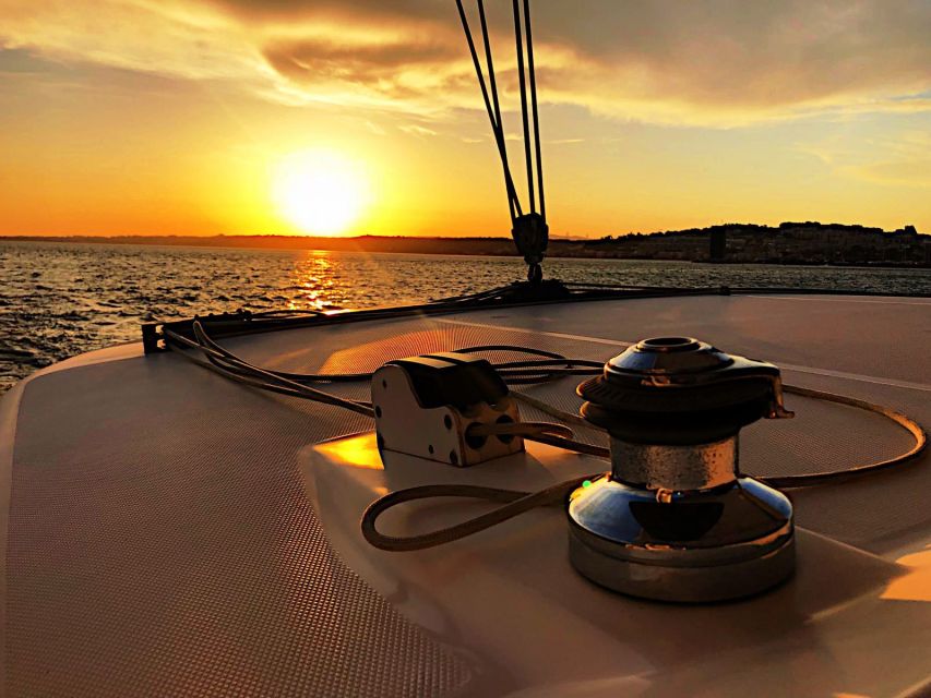 Lisbon: Sunset Cruise With Drinks on Spacious Yacht - Drinks, snacks, and what the price really covers