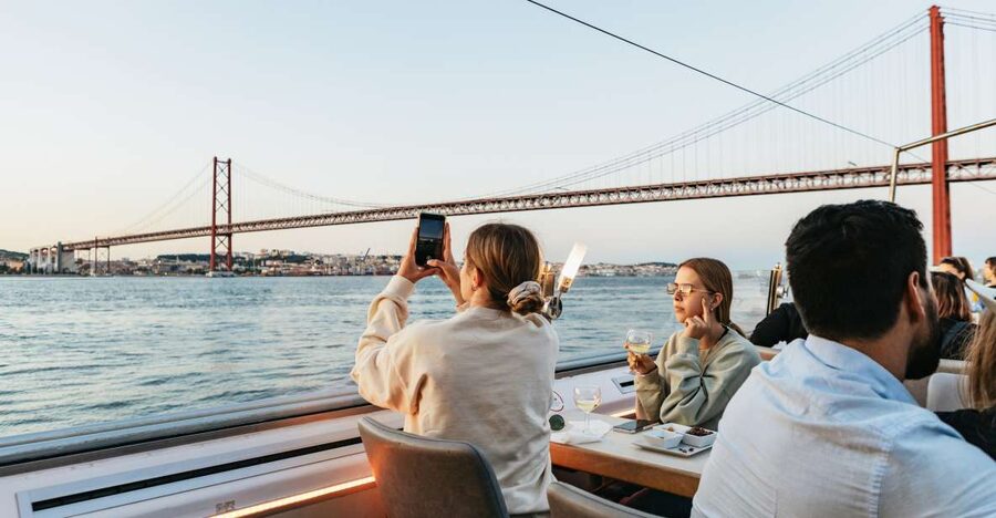 Lisbon: Sunset Cruise with Welcome Drink and Snacks - Under the 25 April Bridge