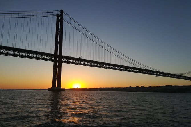 Lisbon: Sunset Sailing with Portuguese Wine and History - Passing under the 25 de Abril Bridge