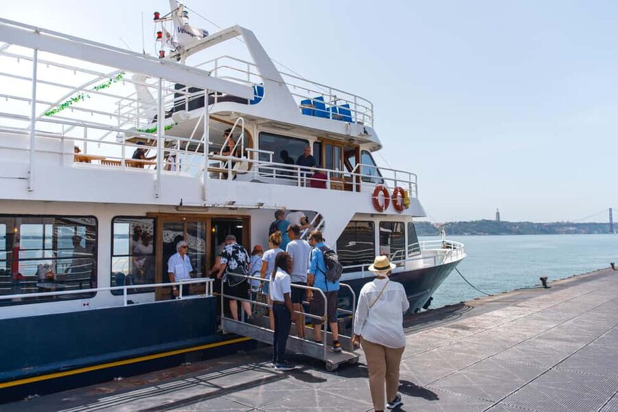 Lisbon: Tagus River Cruise with Welcome Drink - Going beneath the 25th of April Bridge