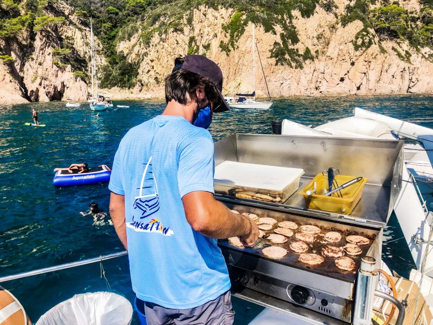 Lloret de Mar: Catamaran Sailing Cruise with BBQ and Drinks - Barbecue lunch after the boat drops anchor