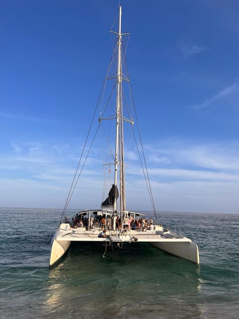 Lloret de Mar: Sunset Catamaran Cruise with DJ and Drinks - Key points at a glance