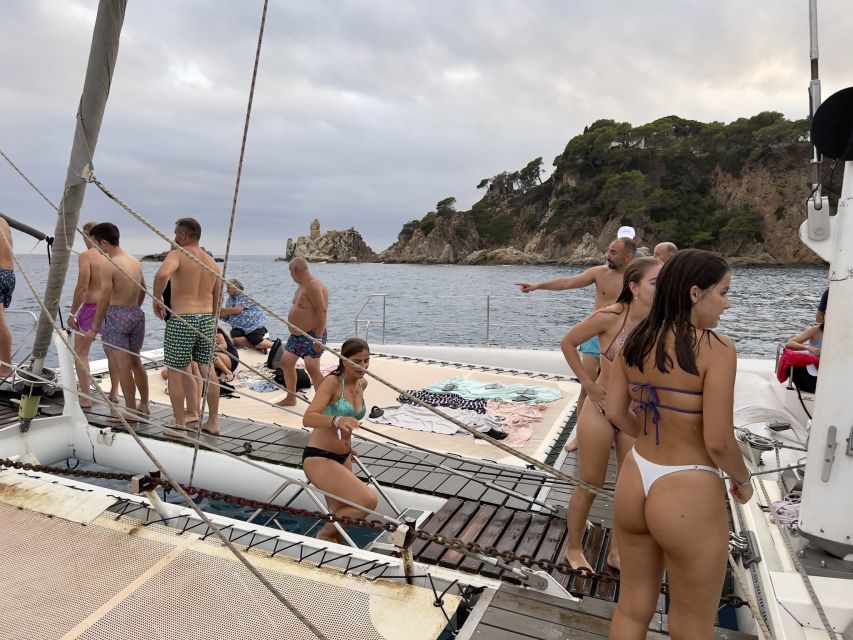 Lloret de Mar: Sunset Catamaran Cruise with DJ and Drinks - Setting sail along the Costa Brava