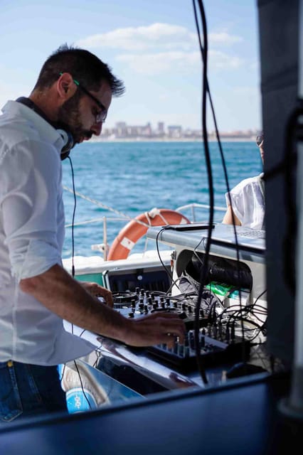 Malaga: Catamaran Sailing Cruise with Swimming & Optional DJ - Drinks, bar service, and the onboard mood
