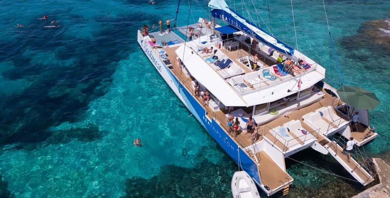 Malta: Blue Lagoon, Beaches & Bays Trip by Catamaran - Crystal Lagoon, cliffs, and underwater caves