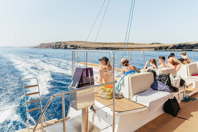Malta: Blue Lagoon, Beaches & Bays Trip by Catamaran - Music, cocktails, and the social atmosphere