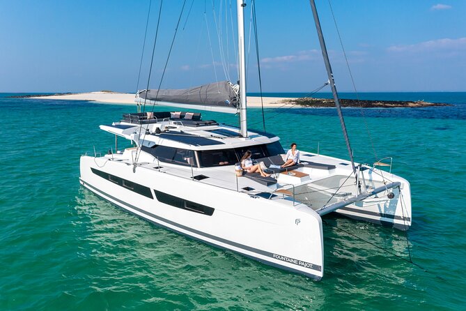 Mykonos: Brand-New Catamaran Cruise with Meal, Drinks & Transport - Aerial and White Coral: what the boats offer