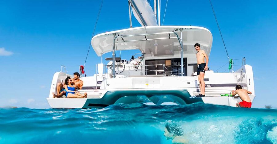 Mykonos: Catamaran Cruise with Lunch, Drinks and Transfer - Lunch arrives while you are still at anchor