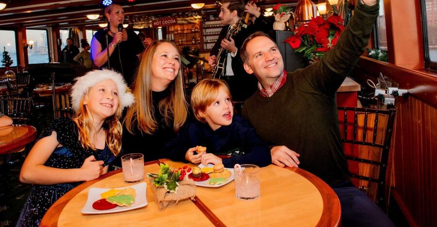 NYC: Holiday Yacht Cruise with Jazz, Cocoa & Carols - The Statue of Liberty photo stop