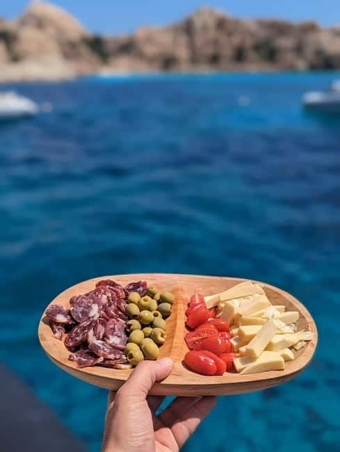 Olbia: Dolphin Watching & Snorkeling Boat Trip - The small aperitif and return to Olbia