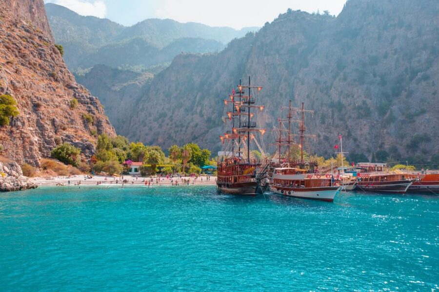 Ölüdeniz: Butterfly Valley Boat Trip with Buffet Lunch - Butterfly Valley: cliffs, beach, and a seasonal catch