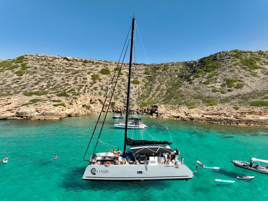 Palma: Cueva Verde and Cala Vella Catamaran Cruise with BBQ - Music and crew shape the mood