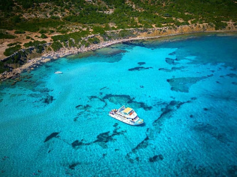 Paphos: Blue Lagoon Boat Adventure with Bus Transfer - Fruit, juice, wine, and the return cruise