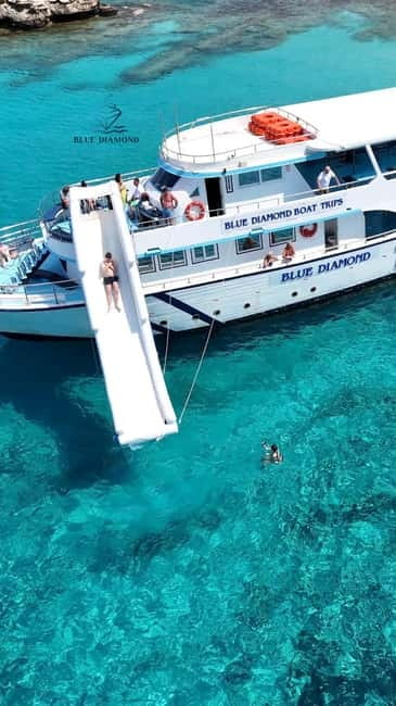 Paphos Blue Lagoon Cruise: Slide, Music & Hotel Transfer - The Akamas Peninsula by boat