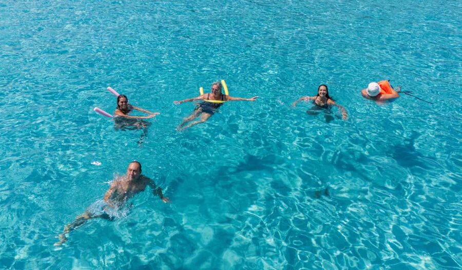 Paphos Blue Lagoon Cruise: Slide, Music & Hotel Transfer - Boarding at Latchi and settling into the boat