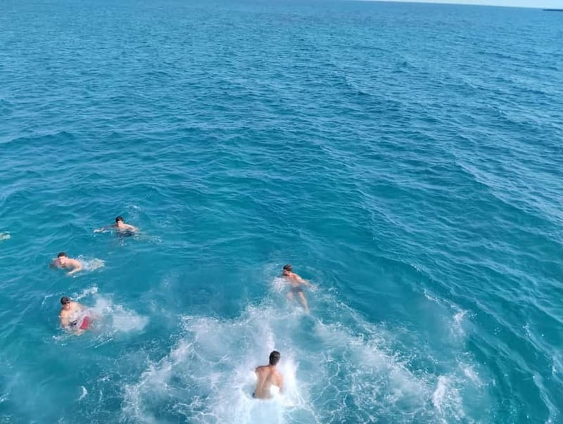 Paphos: Glass Bottom Boat Trip with Swimming or Snorkeling - Crew service and family atmosphere