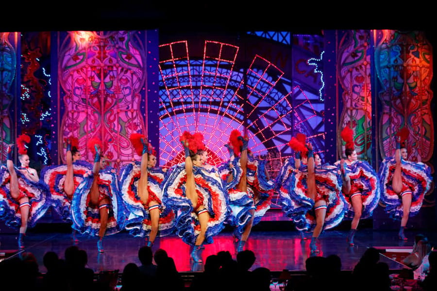 Paris: First Show Moulin Rouge with Champagne & Seine Cruise - Féerie brings feathers, music, and the can-can