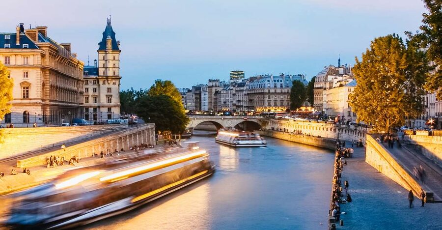 Paris: Illuminated Evening River Cruise & Waffle Tasting - Boarding beneath the Eiffel Tower