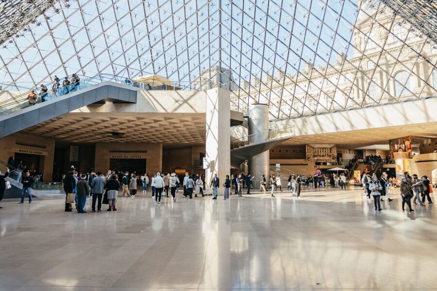 Paris: Louvre Museum Entry Ticket With Host and River Cruise - A one-hour Seine cruise with Paris at water level