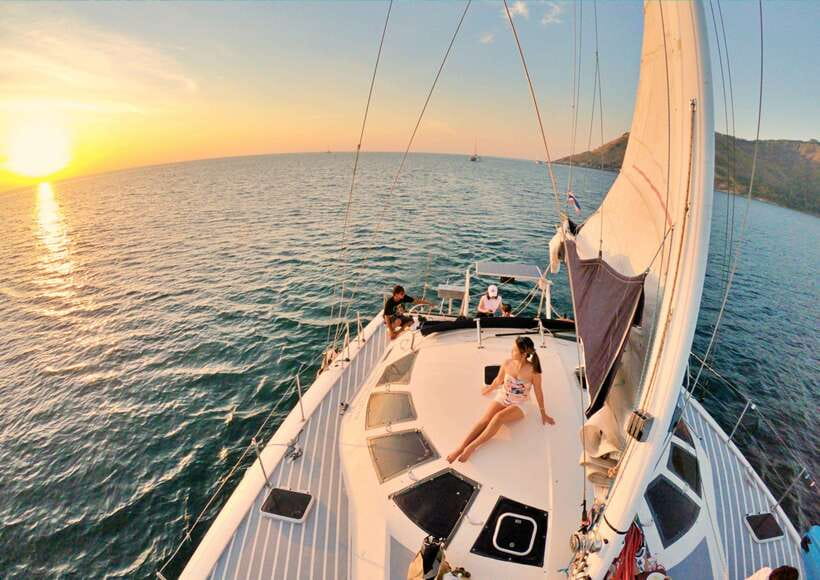 Phuket: Coral Island Catamaran Cruise with Sunset Dinner - Boarding at the pier and settling onto the catamaran