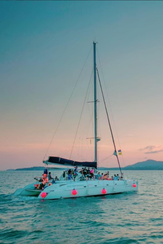 Phuket: Coral Island Catamaran Cruise with Sunset Dinner - Coral Island and Kahung Beach: pretty, easy, and commercial