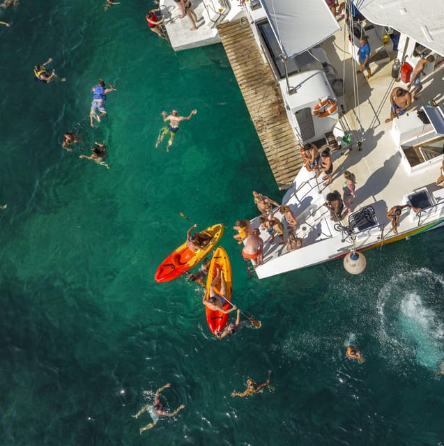 Port d'Alcudia: North Coast Catamaran Cruise with Meal - Swim stops with fish, kayaks, and paddleboards