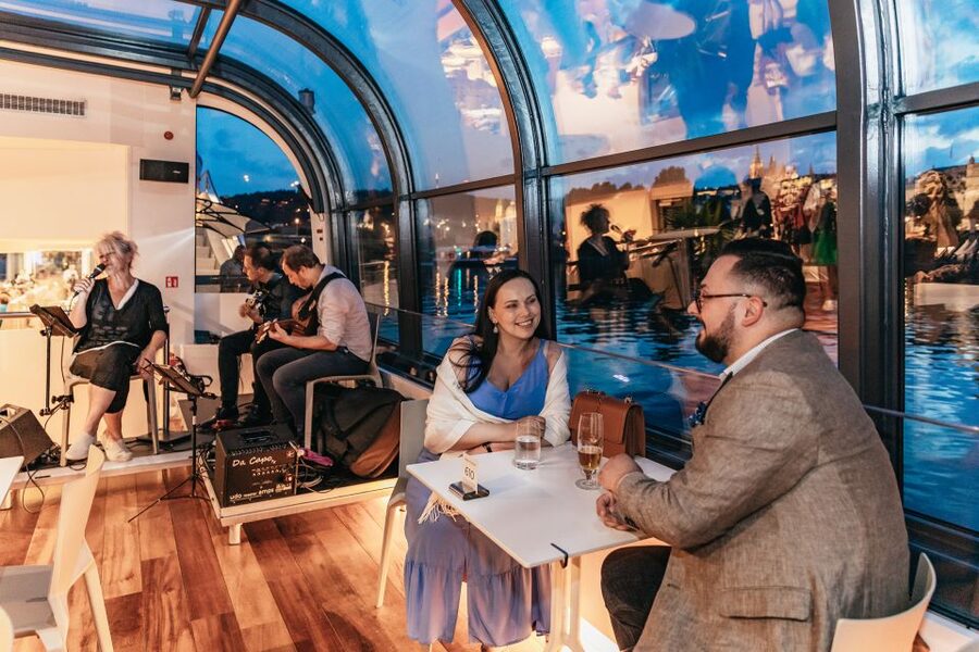 Prague: Sightseeing Dinner Cruise on Open-Top Glass Boat - A modern boat with several ways to see Prague
