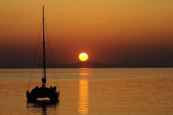 Premium Small-Group Catamaran Cruise with BBQ, Open Bar, Transfer - Red Beach and White Beach from the water