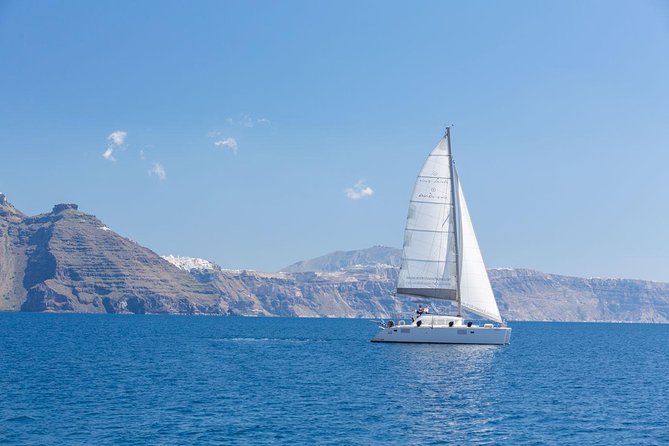 Premium Small-Group Catamaran Cruise with BBQ, Open Bar, Transfer - Thirasia and the caldera towns from sea level