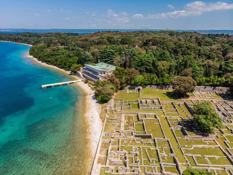 Pula: All-Inclusive Brijuni Boat Tour w Lunch, Drinks & Swim - Boarding the Europa beneath Pula’s Amphitheater