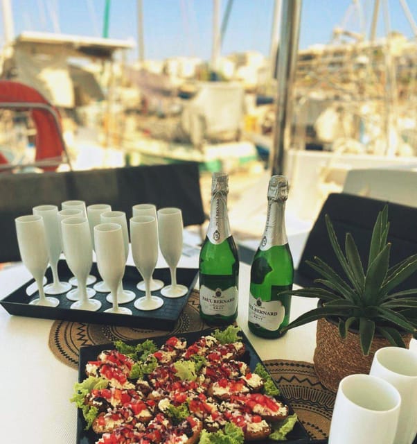 Rethymno: Sunset Catamaran Cruise - Sushi & Open Bar - Leaving Rethymno Marina with Prosecco in hand
