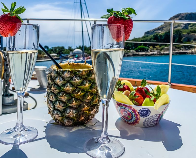 Rhodes: Cruise with 3 Stops, Lunch and Unlimited Drinks - Kallithea Springs: clear water beside rocks and ladders