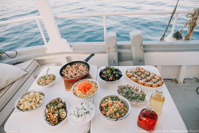 Rhodes Exclusive Swim Cruise Cocktail Open bar & Gourmet Buffet - Leaving Mandraki Harbour with Rhodes behind you