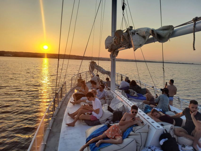 Rhodes: Sunset Cruise with Open Bar, Dinner, & Live Music - Greek dinner with a full bar