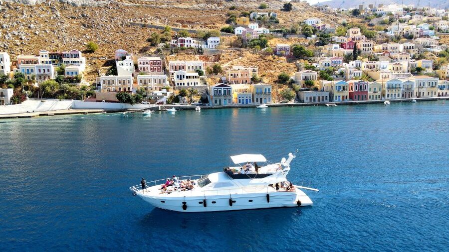 Rhodes: Symi Yacht Tour with Unlimited Drinks and Transfer - Starting at Mandraki Port with coffee and sea air