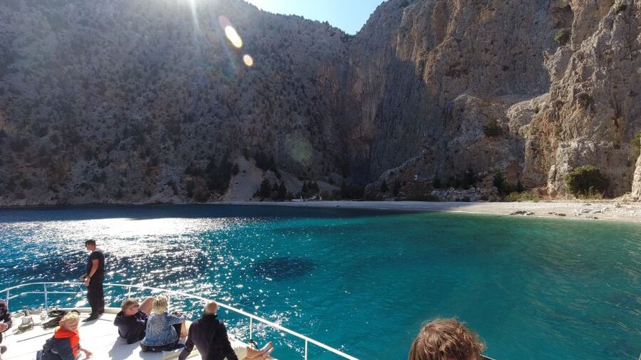 Rhodes: Symi Yacht Tour with Unlimited Drinks and Transfer - Arriving in Symi Town by boat